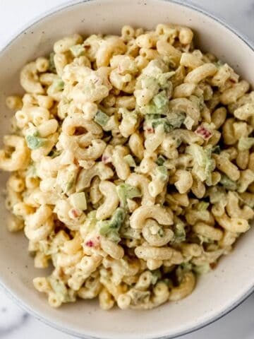 Close up overhead view of macaroni salad in a bowl.