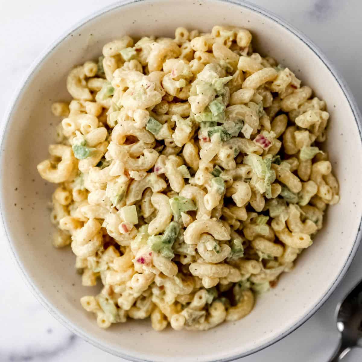 Close up overhead view of macaroni salad in a bowl.