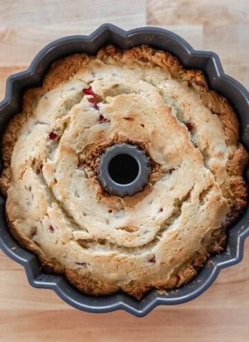 Overhead view of baked cake in bundt pan.