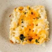 Close up view of piece of casserole in a bowl.