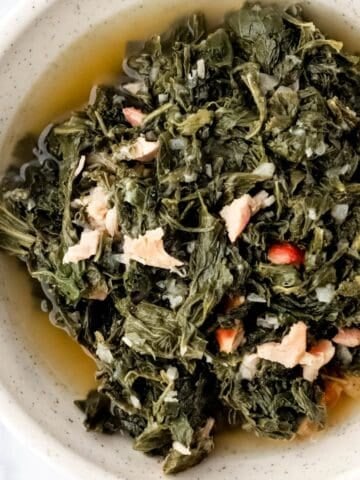 Close up overhead view of bowl of finished mustard greens.