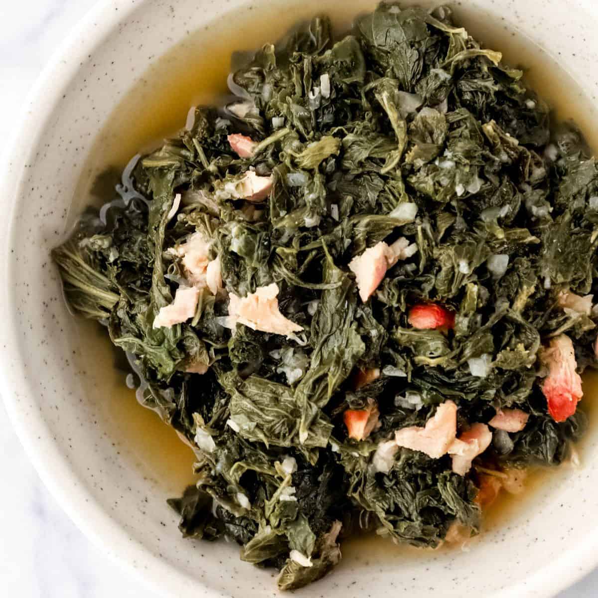 Close up overhead view of bowl of finished mustard greens.