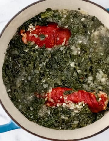 Greens added to the dutch oven with the other ingredients.