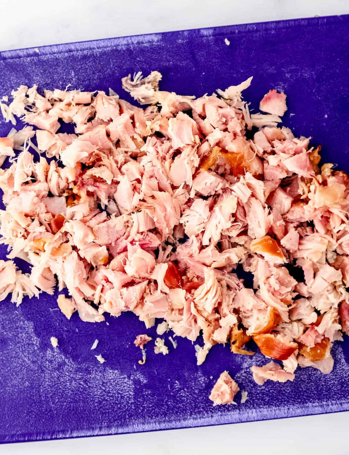 Chopped meat on cutting board.