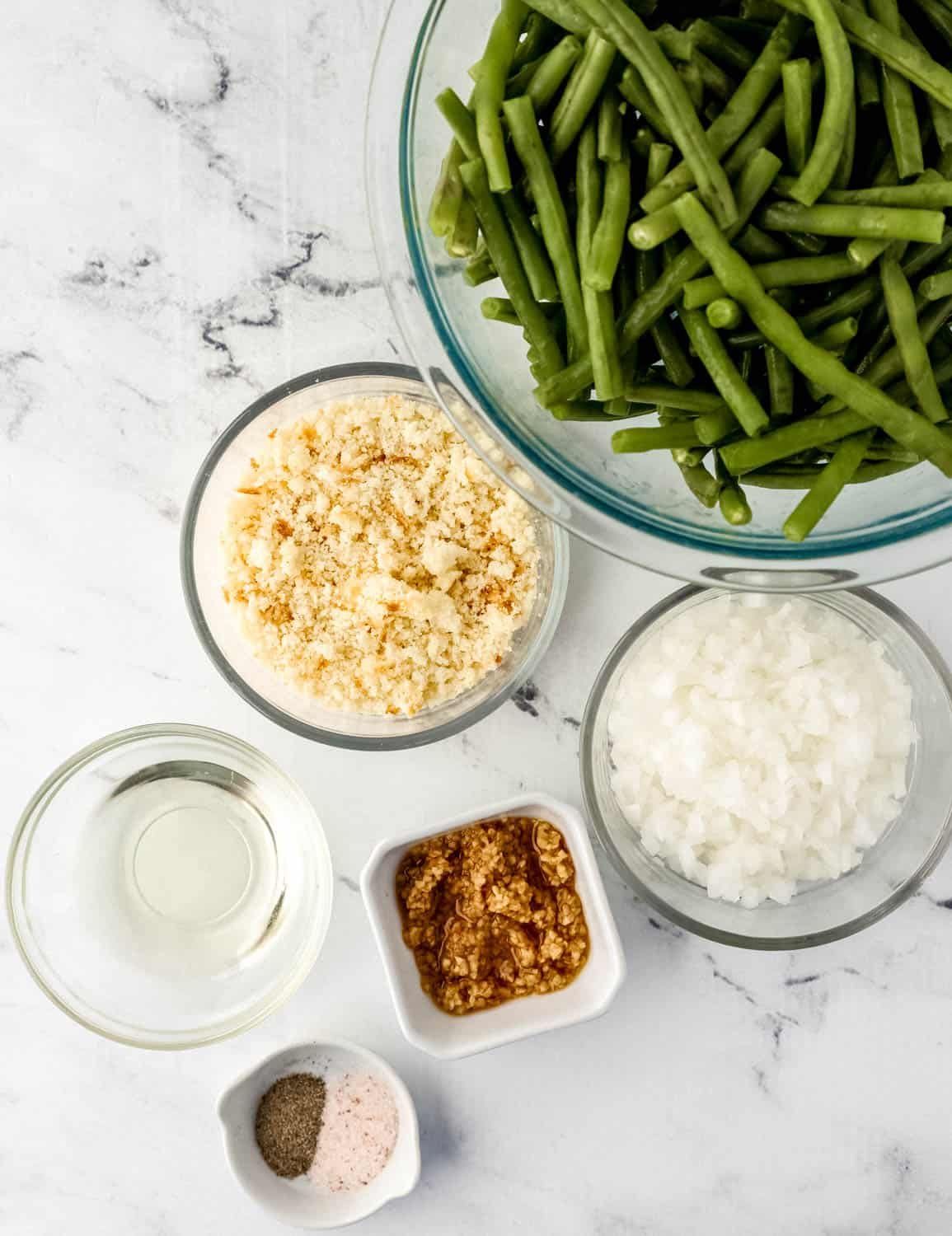Overhead view of ingredients needed to make recipe in separate bowls.