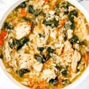 Overhead view of white bowl of soup.