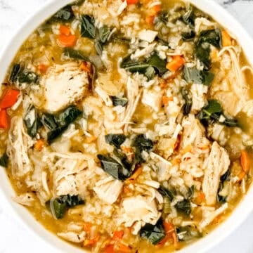 Overhead view of white bowl of soup.