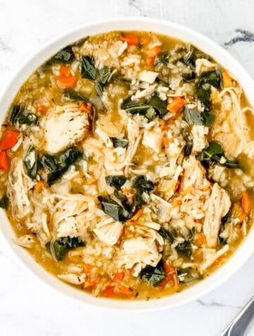 Overhead view of white bowl of soup.