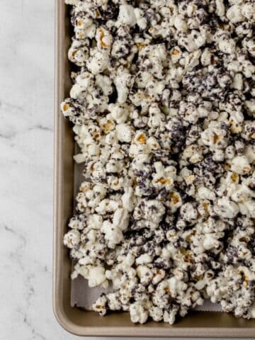 Overhead view of finished popcorn on parchment lined sheet pan.