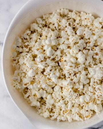 Popcorn in large white mixing bowl.