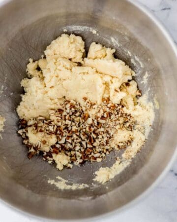 Cookie ingredients combined in stand mixer bowl.