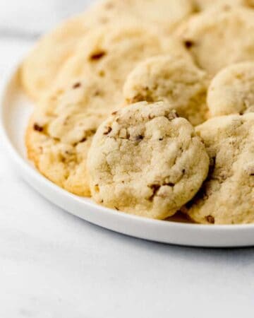 Close up view of cookies on a white plate.