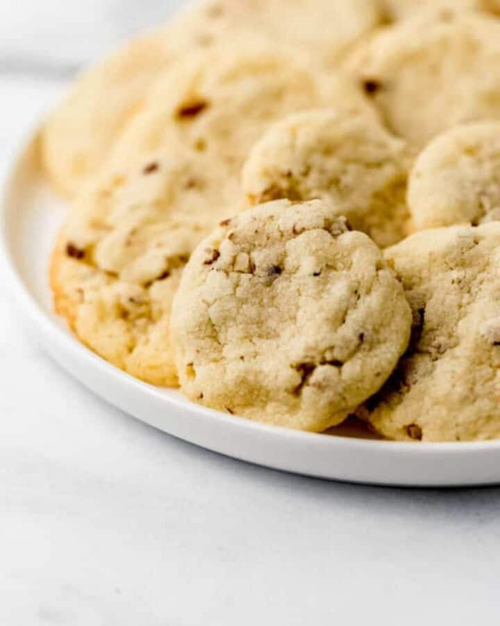 Close up view of cookies on a white plate.